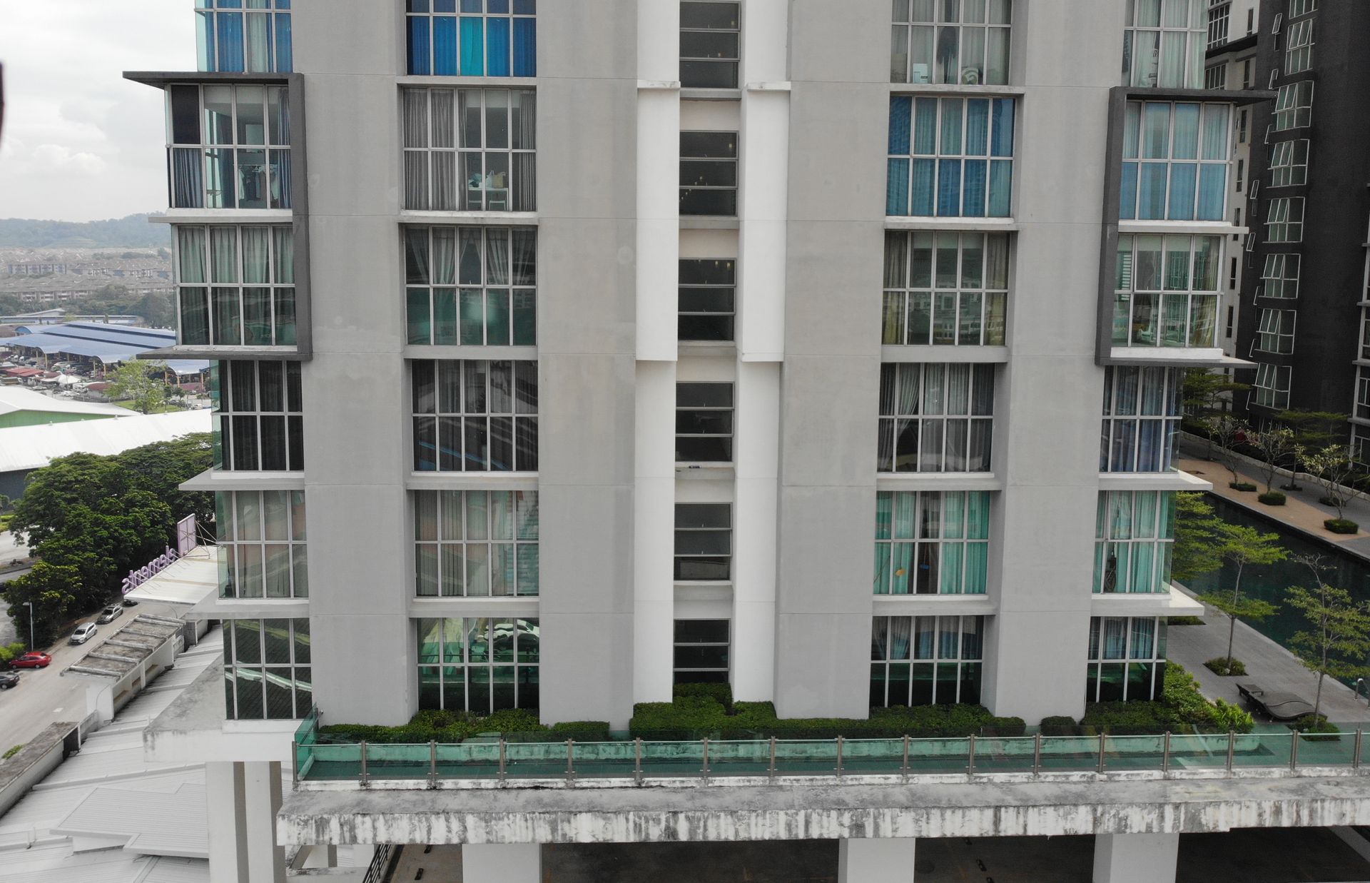 Drone survey view of a residential tower facade