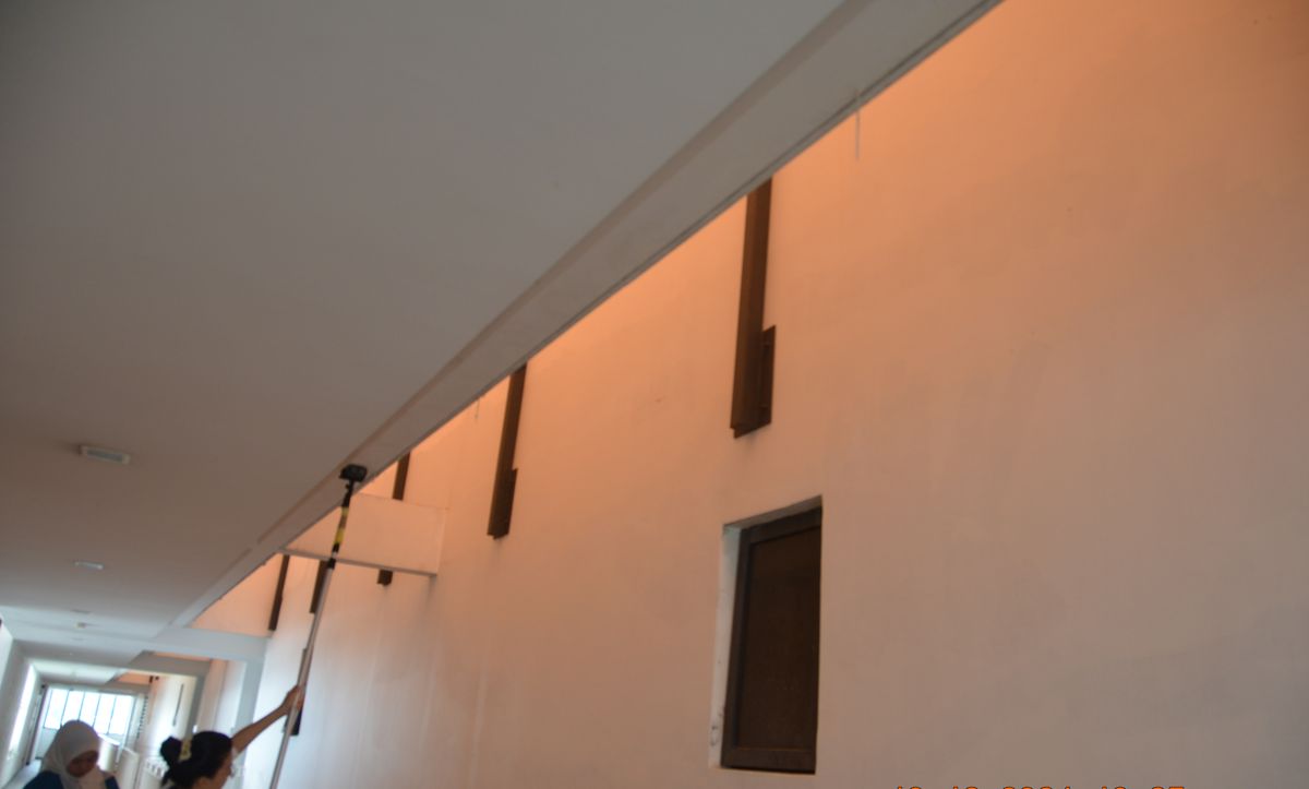Survey team inspecting a common corridor